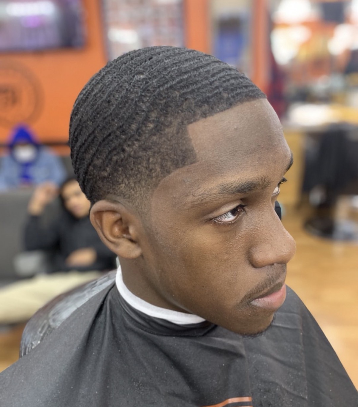 Barber cutting a client's hair
